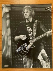 NEIL YOUNG HAND SIGNED 11×14 PHOTO AMAZING IN CONCERT POSE JSA LETTER COLLECTIBLE MEMORABILIA
