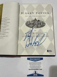 DANIEL RADCLIFFE SIGNED HARRY POTTER AND THE SORCERER’S STONE BOOK BECKETT 126 COLLECTIBLE MEMORABILIA